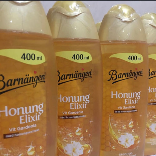 Three bottles of Barnängen Honung Elixir with visible branding and product details.