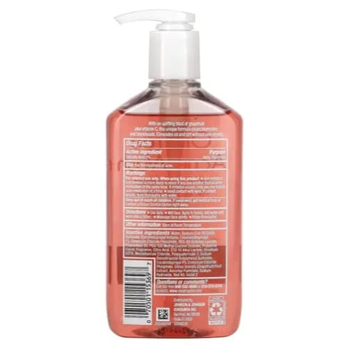 Back view of a bottle with a pump, showing text and a barcode on a white background.