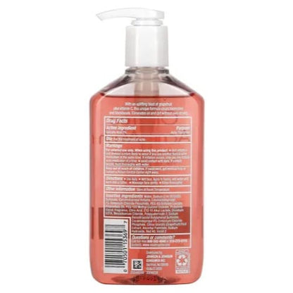 Back view of a bottle with a pump, showing text and a barcode on a white background.