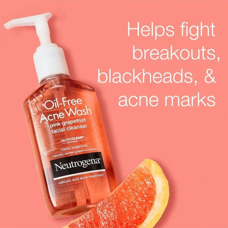 Neutrogena Oil-Free Acne Wash bottle with pink grapefruit on a peach background