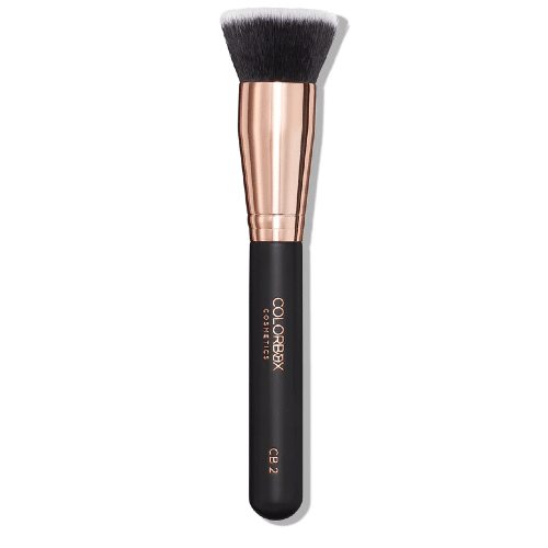 Makeup brush with black bristle head and rose gold ferrule on a white background