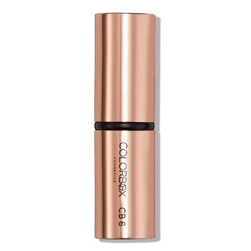 Rose gold lipstick with black band on a white background